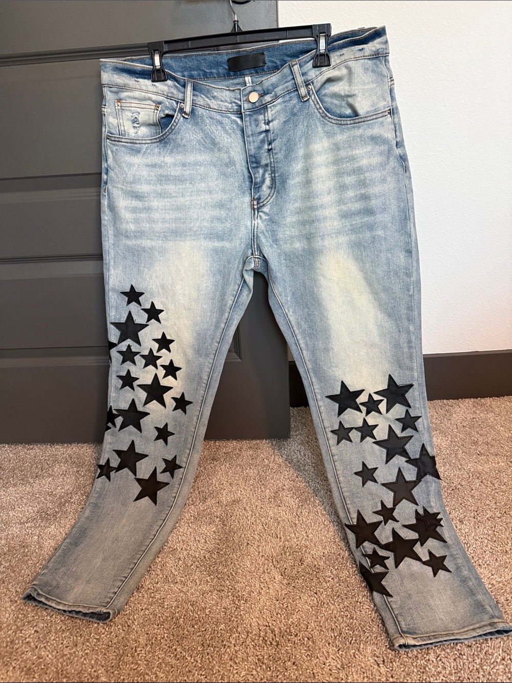 AMIRI Light Blue Denim Jeans with Black Star Motif